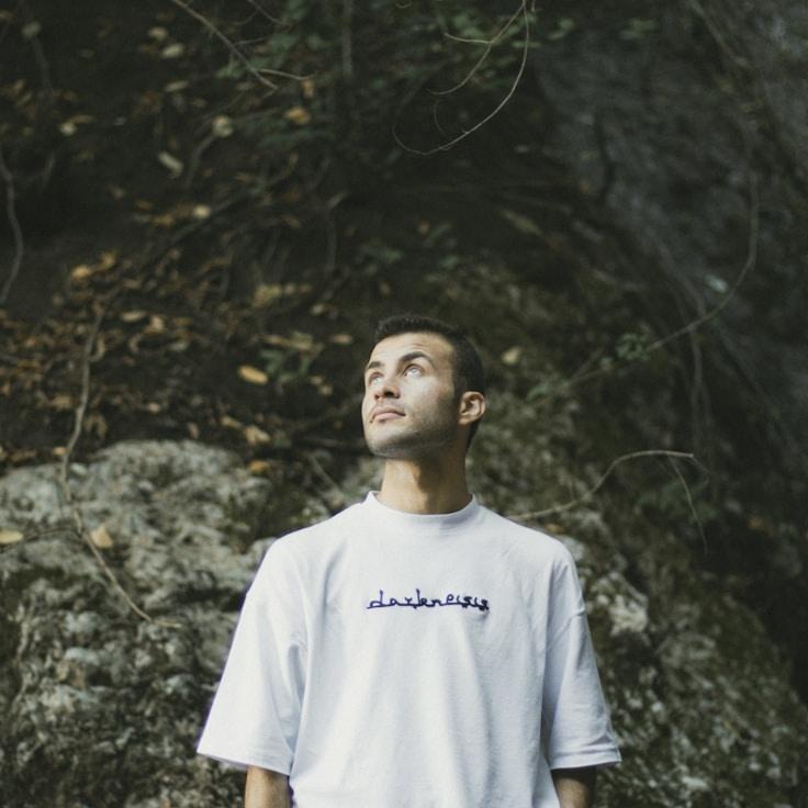 Amina Das, Lead Design Curator at Light Thread Timber, reviewing corporate floral arrangements